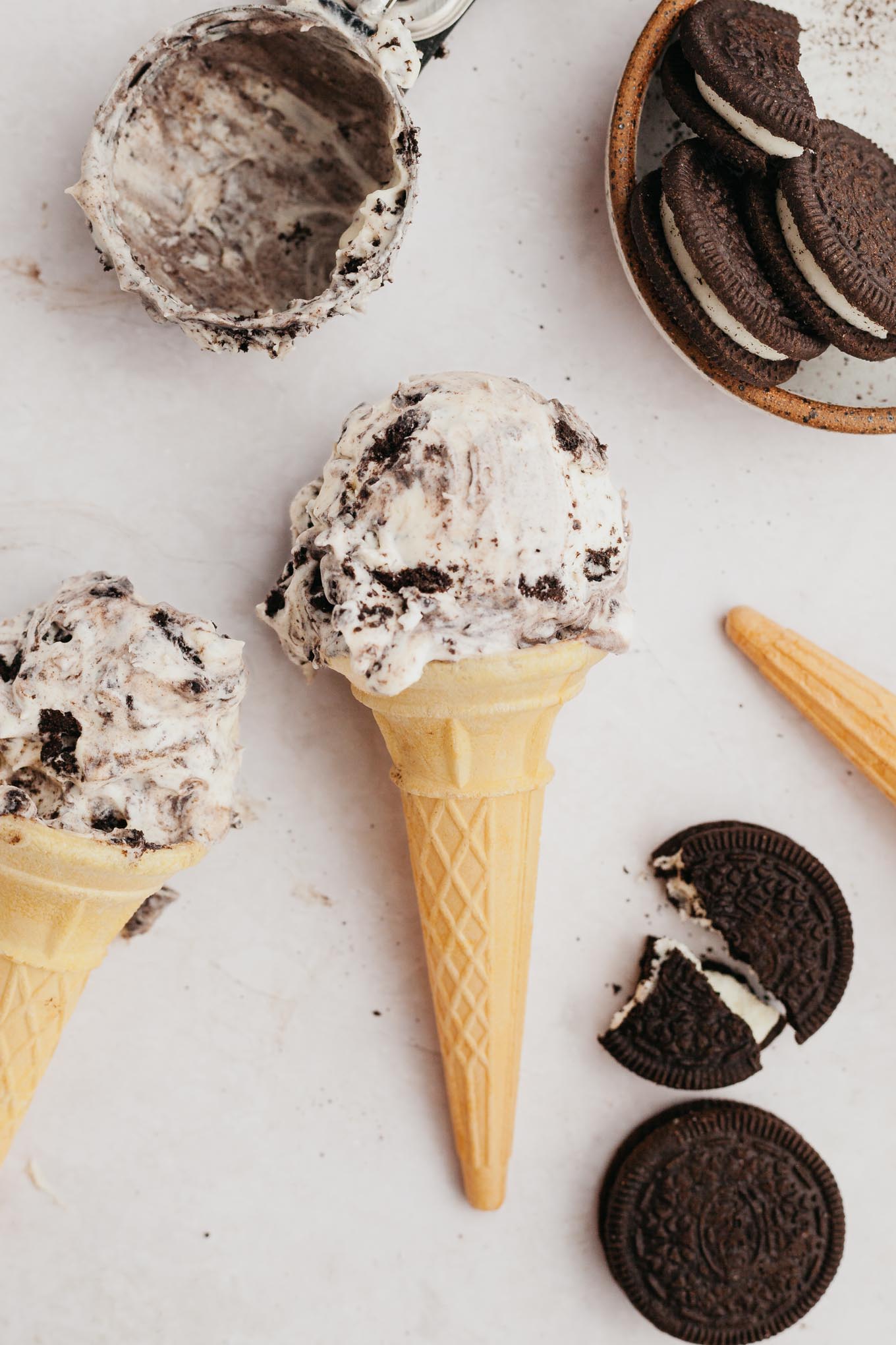 An overhead view of an Oreo ice cream come lying on its side on the countertop. 