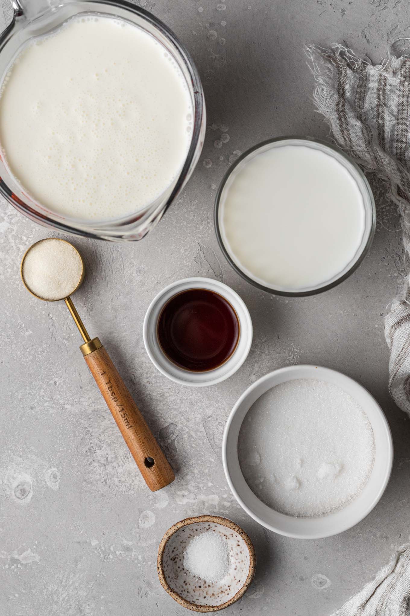 An overhead view of the ingredients needed to make homemade panna cotta. 