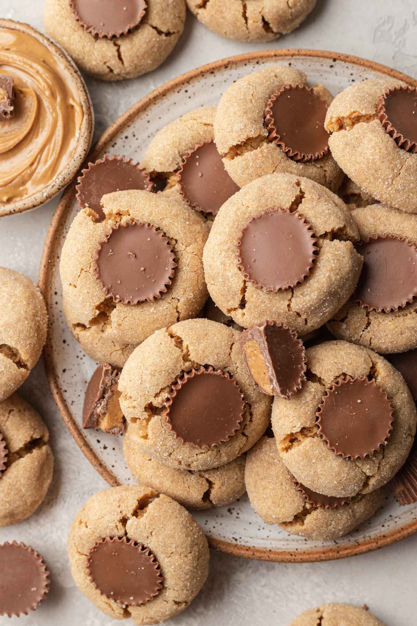 An overhead view of a plate of peanut butter cup cookies. 