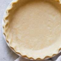 A finished pie crust ready to make a pie.