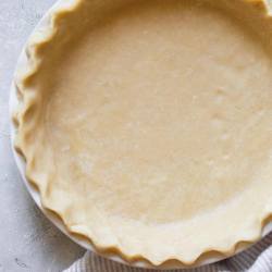 A finished pie crust ready to make a pie.