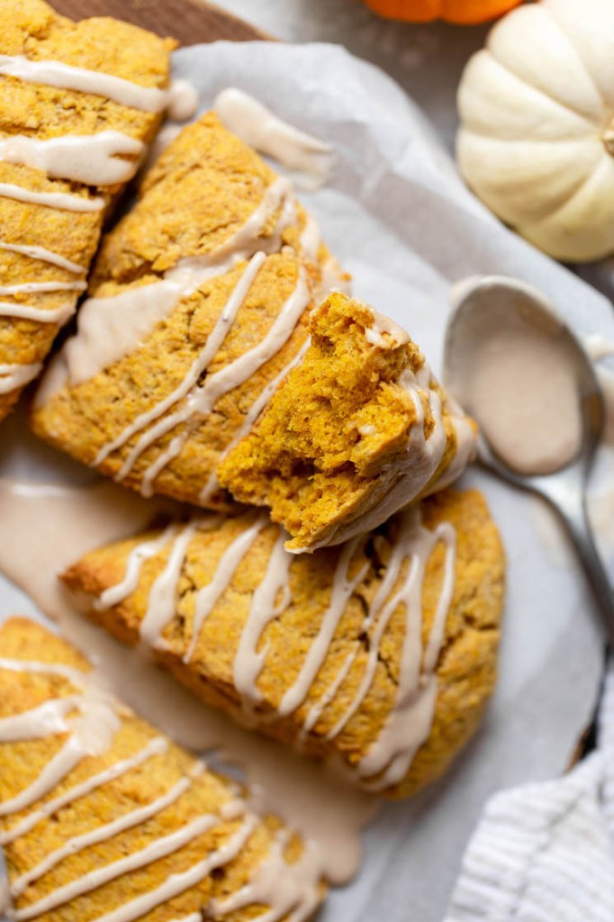 A scone broken in half to show the light and fluffy texture inside. 