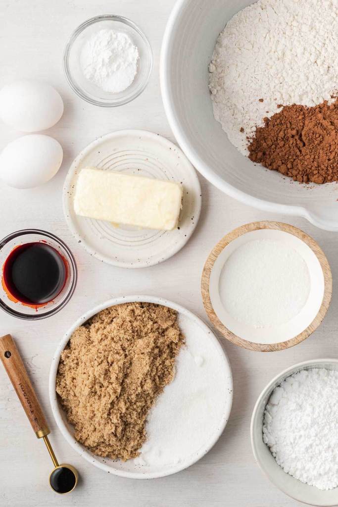 An overhead view of the ingredients needed to make red velvet cookies. 