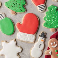 An overhead view of several sugar cookies topped with royal icing.