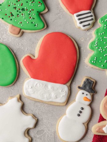 An overhead view of several sugar cookies topped with royal icing.