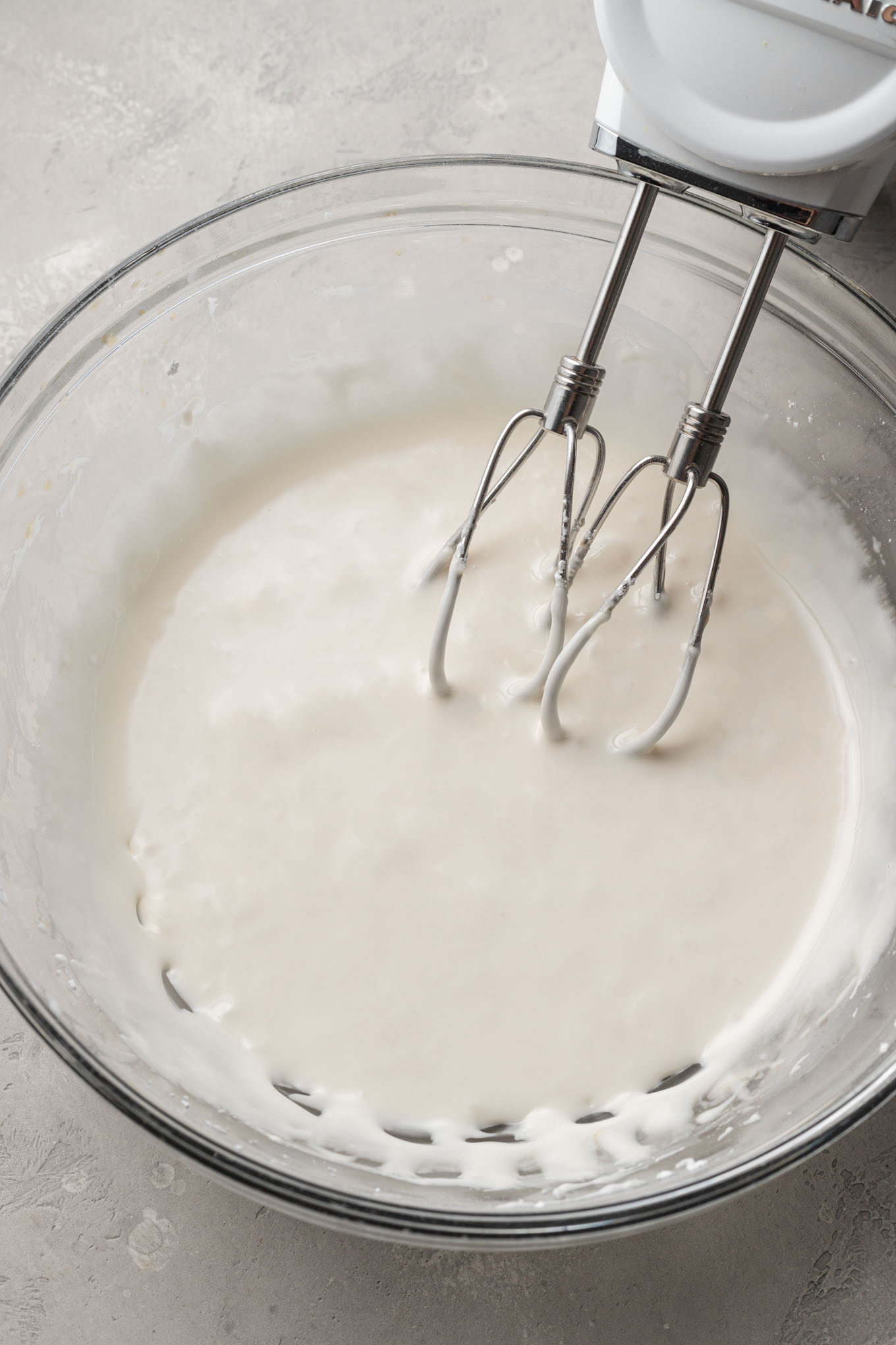 Warm water, corn syrup, and vanilla added to the mixing bowl.