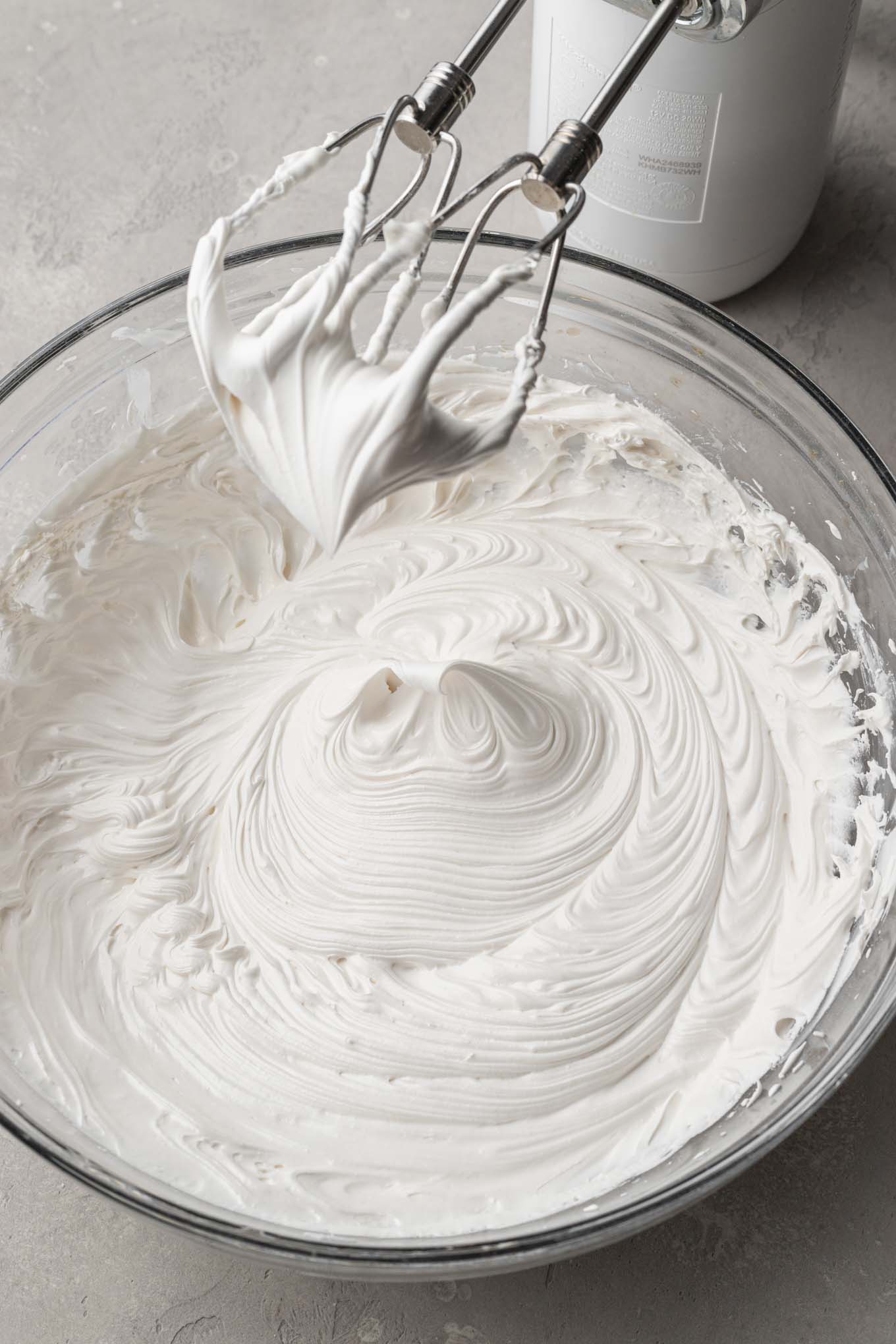 A bowl of royal icing beat to stiff peaks.