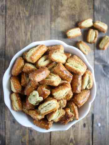 Overhead view of ranch pretzels in a white bowl.