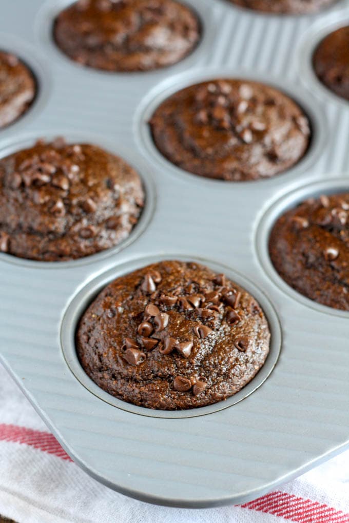 Healthy double chocolate chip muffins in a muffin tin. 