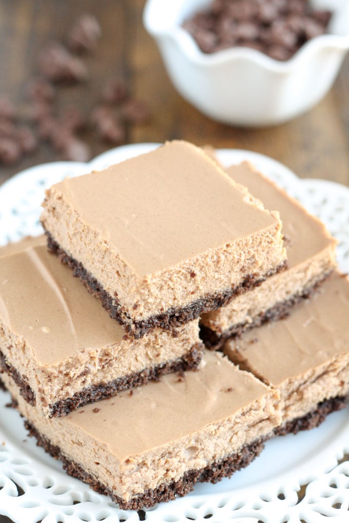 These Skinny Mocha Cheesecake Bars are lightened up with Greek yogurt and less sugar! Serve these bars for an easy and lighter dessert.