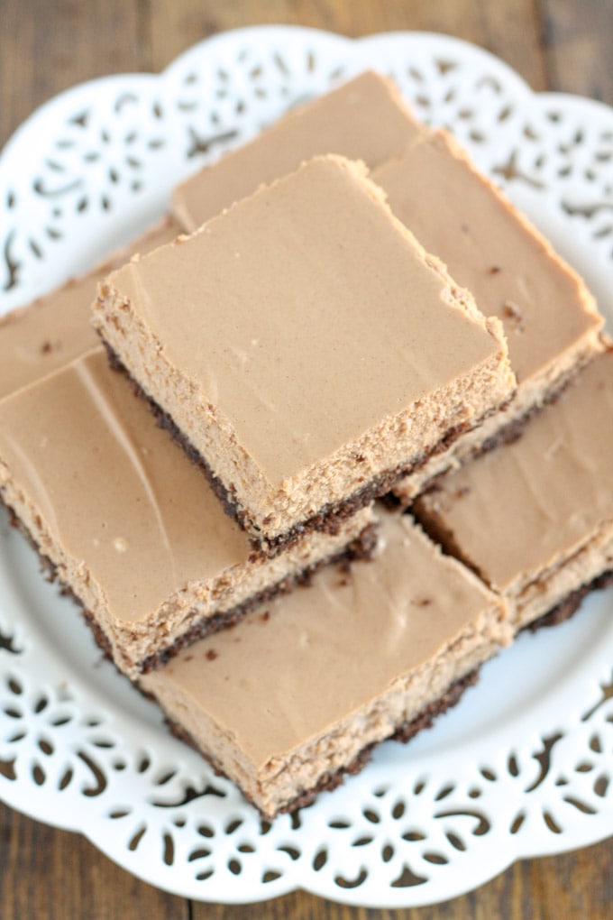 These Skinny Mocha Cheesecake Bars are lightened up with Greek yogurt and less sugar! Serve these bars for an easy and lighter dessert.