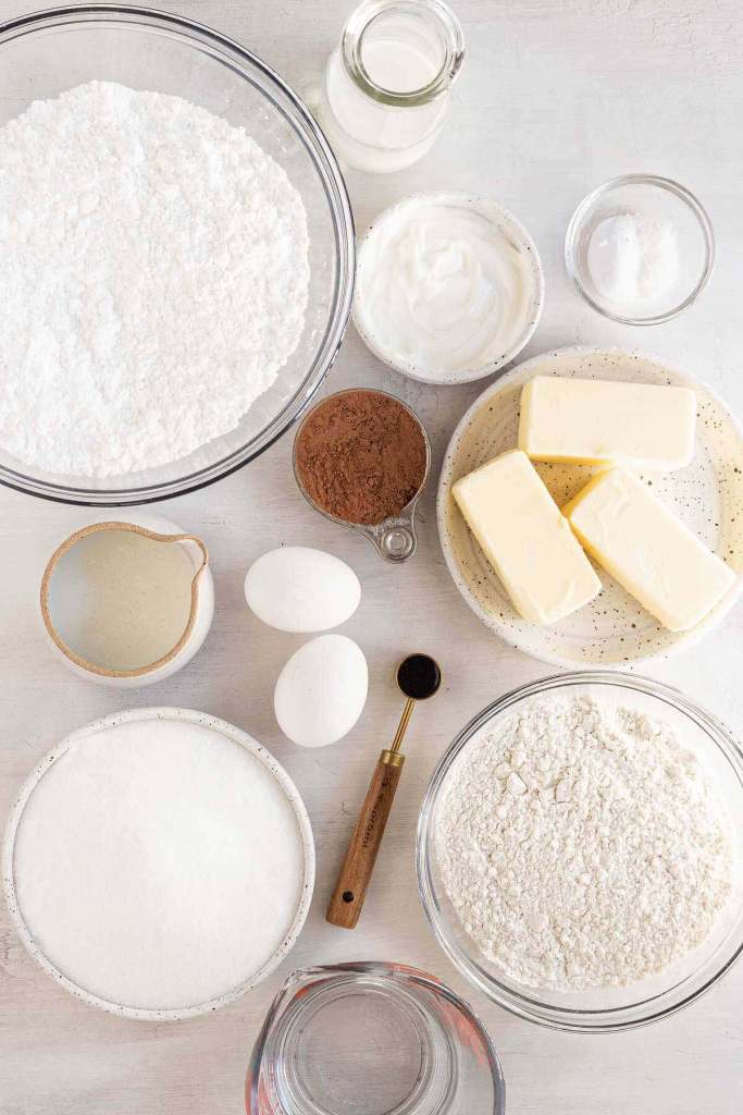 An overhead view of the ingredients needed to make a chocolate sheet cake. 