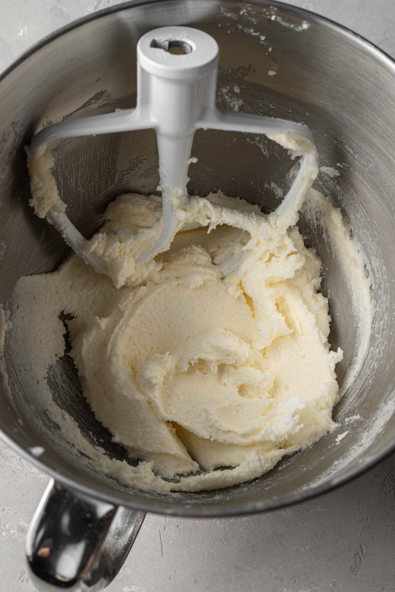 An overhead view of butter and sugar that's been beaten until light and fluffy.